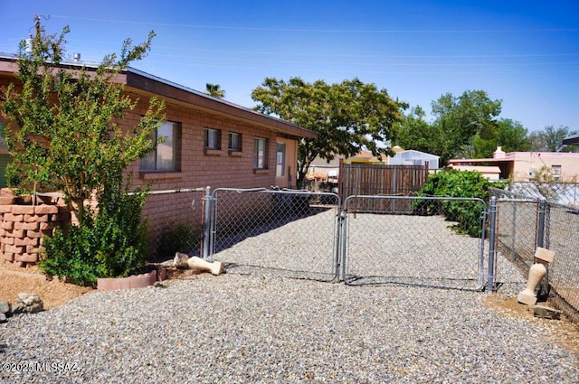 326 N Sage St, Pearce, AZ 85625 - view of side of home featuring a gate