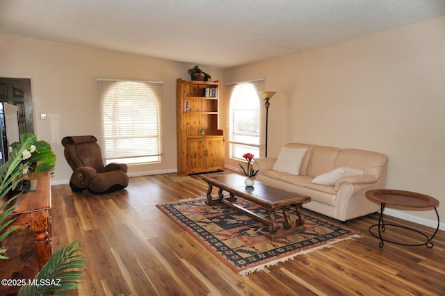 326 N Sage St, Pearce, AZ 85625 - living room with wood finished floors and healthy amount of natural light