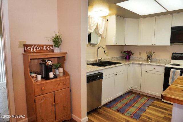 326 N Sage St, Pearce, AZ 85625 - kitchen with stainless steel dishwasher, range with electric stovetop, dark wood finished floors, and white cabinets