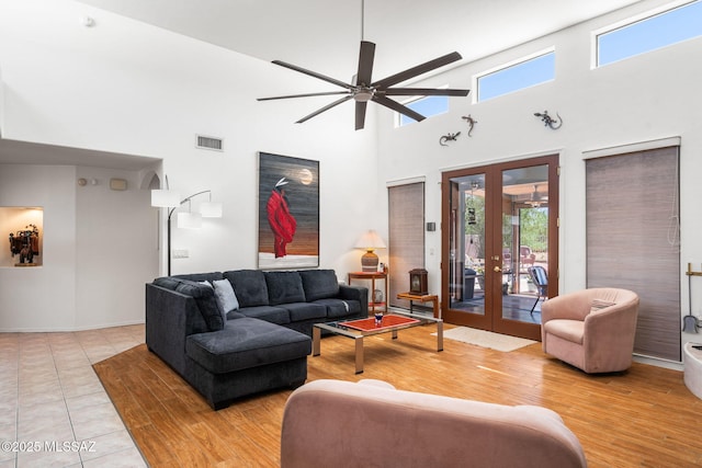 14092 E Placita Mochuelo, Vail, AZ 85641 - living room featuring a ceiling fan, a towering ceiling, french doors, and wood finished floors