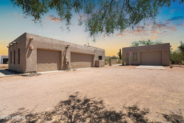 14092 E Placita Mochuelo, Vail, AZ 85641 - view of garage at dusk