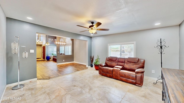 8942 N Ferber Ct, Tucson, AZ 85742 - living room with ceiling fan and recessed lighting