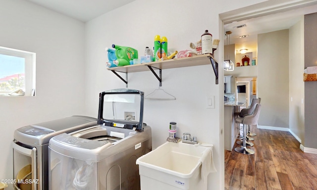 8942 N Ferber Ct, Tucson, AZ 85742 - laundry area with washer and dryer and wood finished floors