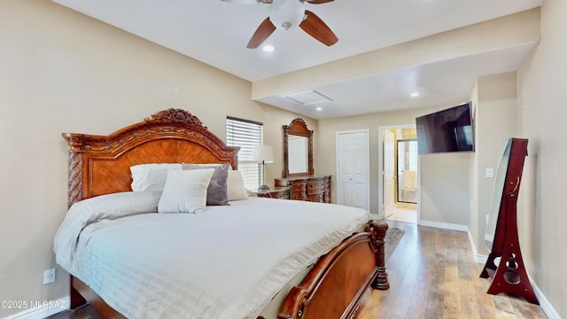 8942 N Ferber Ct, Tucson, AZ 85742 - bedroom featuring multiple windows, hardwood / wood-style flooring, recessed lighting, ensuite bath, and a ceiling fan