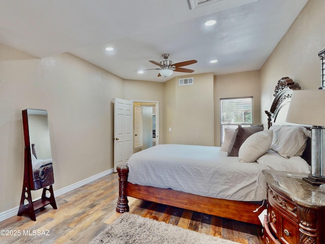 8942 N Ferber Ct, Tucson, AZ 85742 - bedroom with light wood-type flooring, recessed lighting, and a ceiling fan