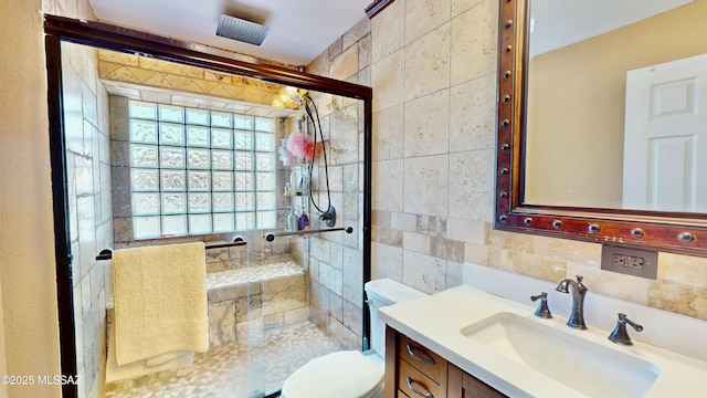8942 N Ferber Ct, Tucson, AZ 85742 - bathroom featuring tile walls, a stall shower, and vanity