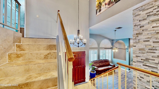 8942 N Ferber Ct, Tucson, AZ 85742 - foyer with a chandelier, a ceiling fan, and stairs