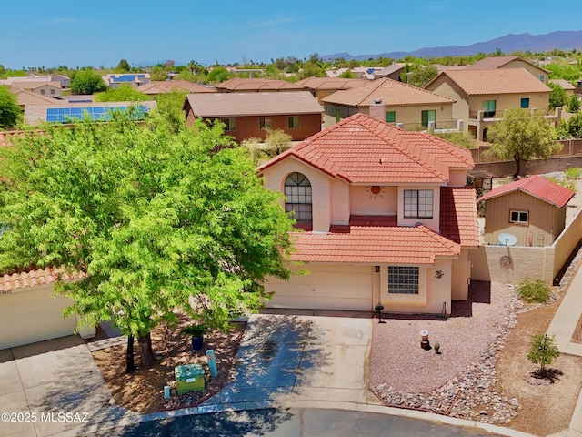 8942 N Ferber Ct, Tucson, AZ 85742 - mediterranean / spanish home with a tile roof, a residential view, and stucco siding