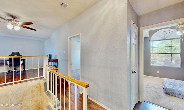 8942 N Ferber Ct, Tucson, AZ 85742 - hall with an upstairs landing and wood finished floors