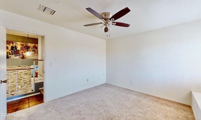 8942 N Ferber Ct, Tucson, AZ 85742 - carpeted spare room with ceiling fan and baseboards