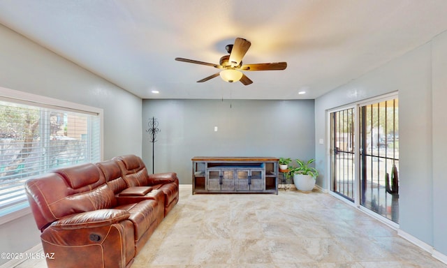 8942 N Ferber Ct, Tucson, AZ 85742 - living room featuring healthy amount of natural light, ceiling fan, and recessed lighting
