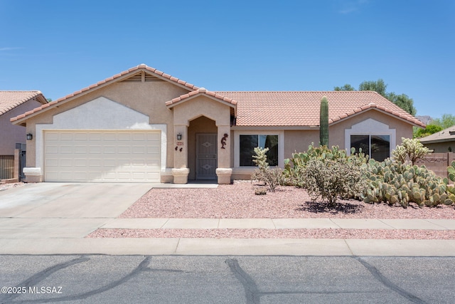 5442 W Cochie Springs St, Marana, AZ 85658 - view of front facade featuring a garage, stucco siding, driveway, and a tile roof
