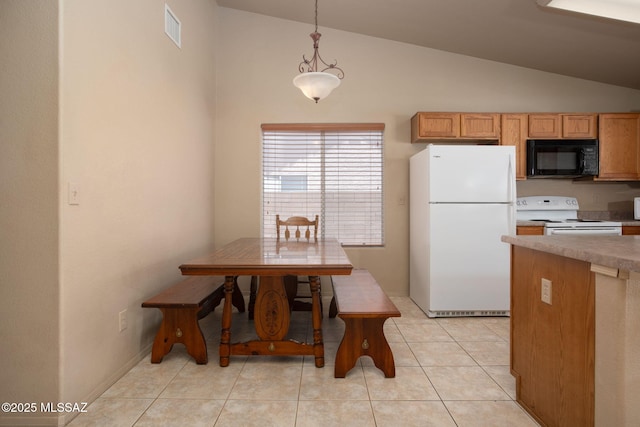 5442 W Cochie Springs St, Marana, AZ 85658 - kitchen with white appliances, hanging light fixtures, light tile patterned floors, light countertops, and high vaulted ceiling