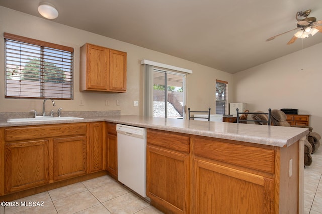 5442 W Cochie Springs St, Marana, AZ 85658 - kitchen with dishwasher, a peninsula, light tile patterned floors, ceiling fan, and vaulted ceiling