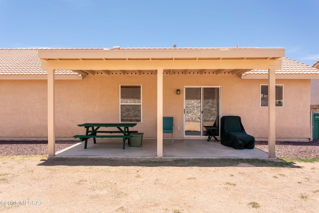 5442 W Cochie Springs St, Marana, AZ 85658 - back of house with stucco siding, a patio, and a tiled roof