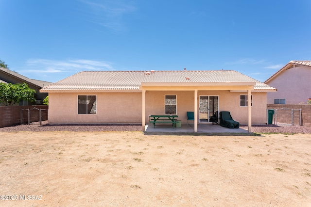 5442 W Cochie Springs St, Marana, AZ 85658 - back of house featuring a tile roof, stucco siding, and a patio