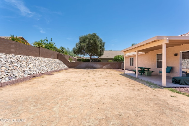 5442 W Cochie Springs St, Marana, AZ 85658 - fenced backyard featuring a patio