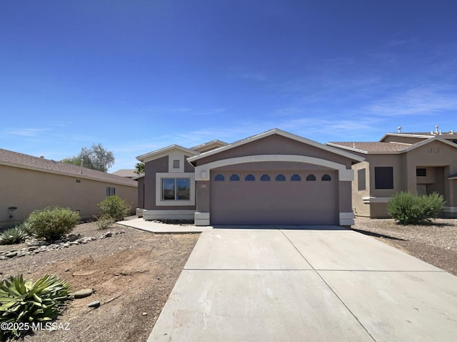 8758 E Mountain Spring Dr, Tucson, AZ 85747 - single story home featuring concrete driveway, a garage, and stucco siding