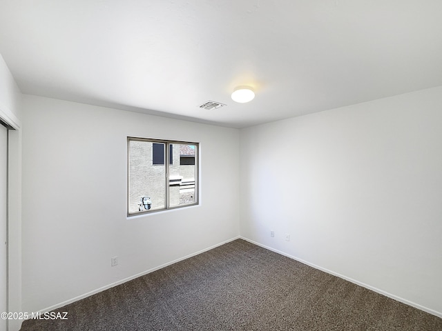 8758 E Mountain Spring Dr, Tucson, AZ 85747 - unfurnished room featuring dark carpet and baseboards