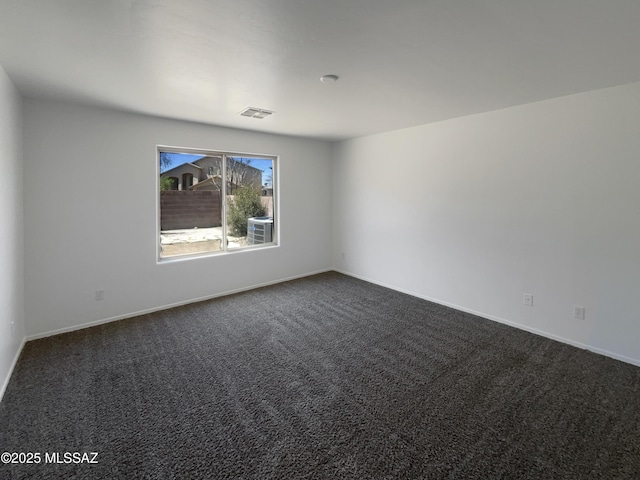 8758 E Mountain Spring Dr, Tucson, AZ 85747 - unfurnished room featuring dark colored carpet