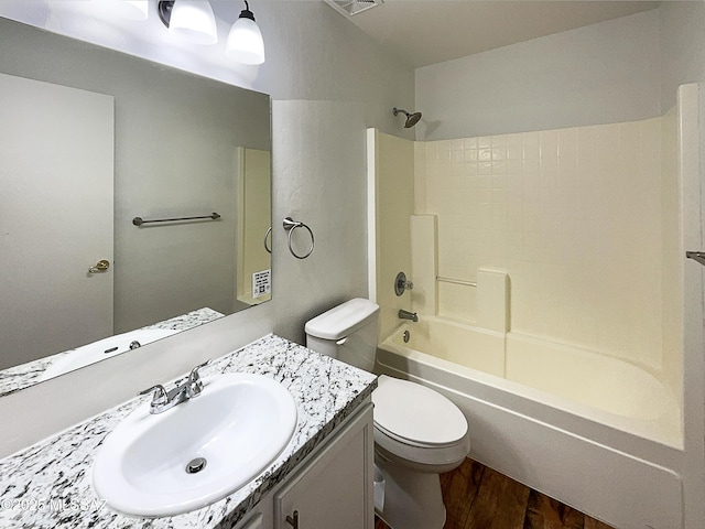 8758 E Mountain Spring Dr, Tucson, AZ 85747 - full bath featuring wood finished floors, vanity, and bathtub / shower combination