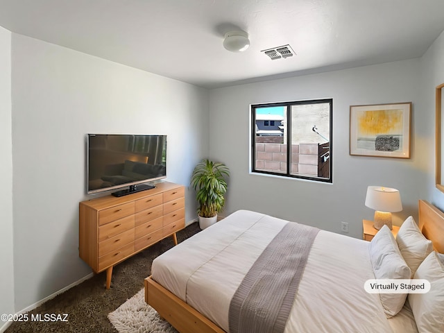 8758 E Mountain Spring Dr, Tucson, AZ 85747 - bedroom with dark carpet and baseboards