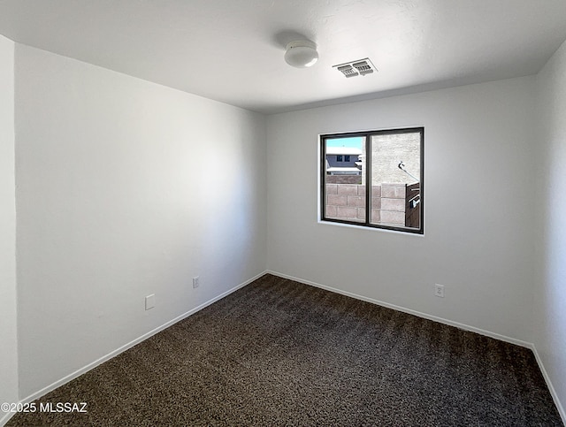 8758 E Mountain Spring Dr, Tucson, AZ 85747 - unfurnished room with dark carpet and baseboards