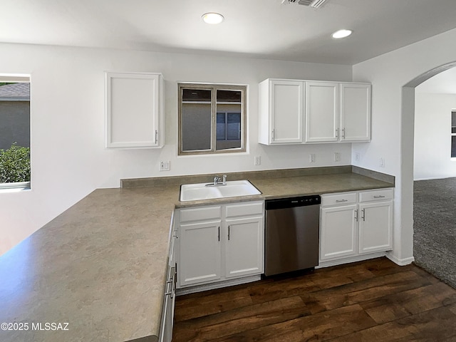8758 E Mountain Spring Dr, Tucson, AZ 85747 - kitchen with dishwasher, arched walkways, dark wood finished floors, white cabinets, and recessed lighting