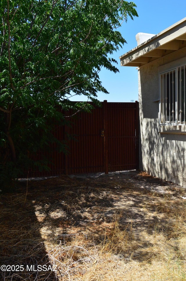 1809 E Miles St, Tucson, AZ 85719 - view of yard with a gate