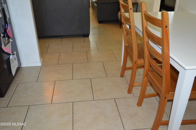 1809 E Miles St, Tucson, AZ 85719 - dining space with light tile patterned floors
