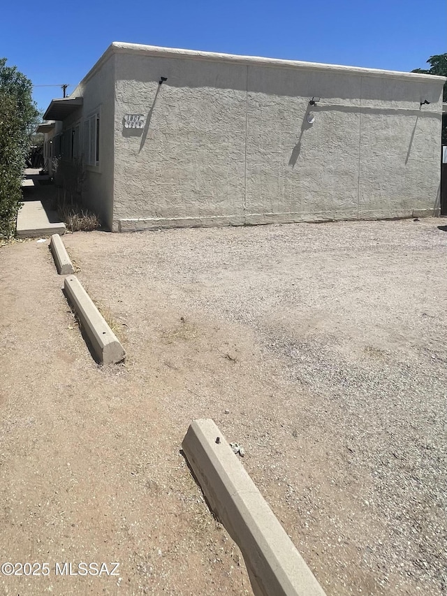 1809 E Miles St, Tucson, AZ 85719 - view of side of property with stucco siding
