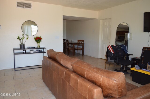 1809 E Miles St, Tucson, AZ 85719 - living area with light tile patterned floors and arched walkways