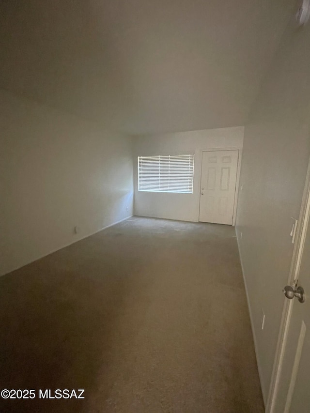 1809 E Miles St, Tucson, AZ 85719 - carpeted spare room featuring baseboards and a smoke detector