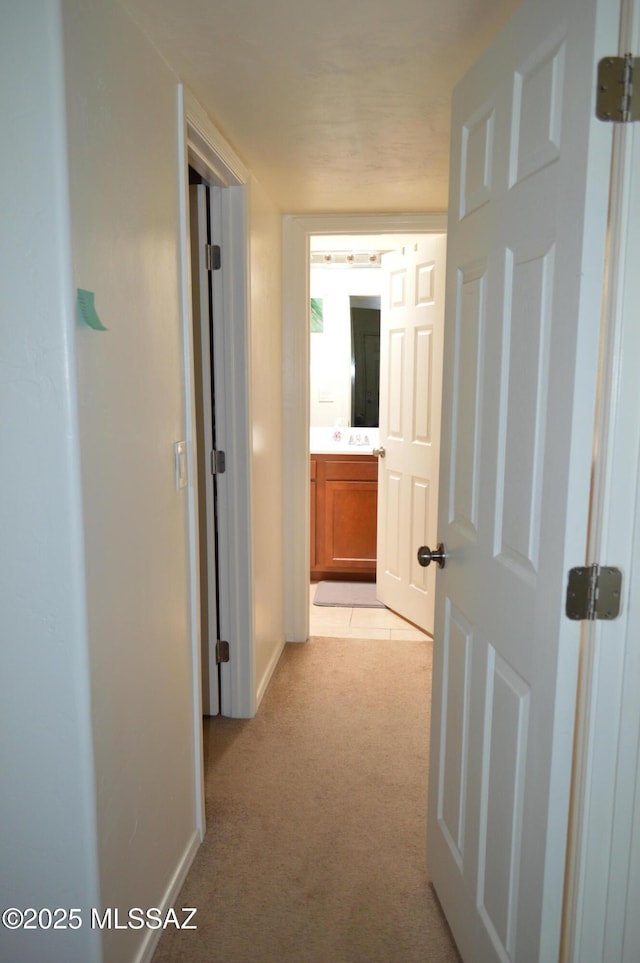 1809 E Miles St, Tucson, AZ 85719 - corridor featuring light carpet and baseboards