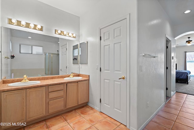 11120 E Mountain Gate Pl, Tucson, AZ 85749 - ensuite bathroom with tile patterned floors, ceiling fan, double vanity, and a shower stall