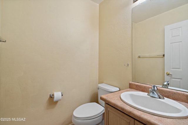 11120 E Mountain Gate Pl, Tucson, AZ 85749 - half bathroom featuring vanity and toilet