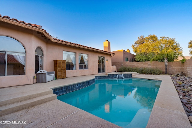 11120 E Mountain Gate Pl, Tucson, AZ 85749 - view of swimming pool featuring a fenced backyard, a patio, and a pool with connected hot tub