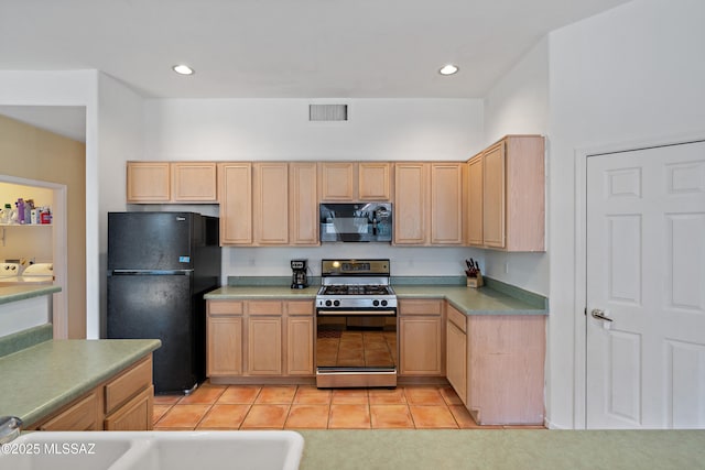 11120 E Mountain Gate Pl, Tucson, AZ 85749 - kitchen with black appliances, light brown cabinets, light tile patterned floors, recessed lighting, and light countertops
