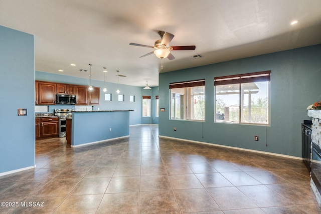 9407 E Greek Sage Way, Vail, AZ 85641 - unfurnished living room with ceiling fan, dark tile patterned floors, recessed lighting, and a glass covered fireplace