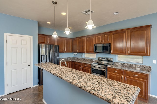 9407 E Greek Sage Way, Vail, AZ 85641 - kitchen featuring stainless steel appliances, light stone countertops, hanging light fixtures, an island with sink, and recessed lighting