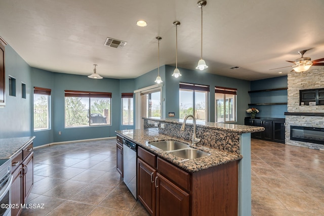 9407 E Greek Sage Way, Vail, AZ 85641 - kitchen with dishwasher, open floor plan, a fireplace, tile patterned flooring, and ceiling fan