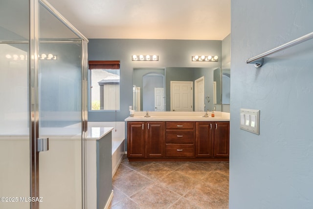 9407 E Greek Sage Way, Vail, AZ 85641 - bathroom with double vanity, a garden tub, and a stall shower