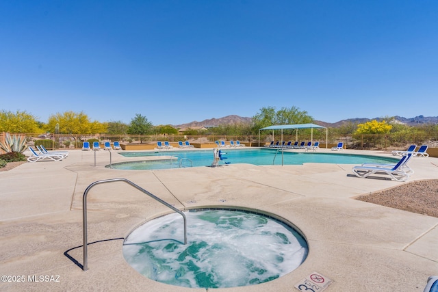 9407 E Greek Sage Way, Vail, AZ 85641 - community pool with a community hot tub, a mountain view, and a patio