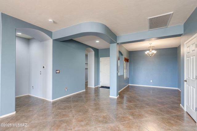 9407 E Greek Sage Way, Vail, AZ 85641 - empty room featuring arched walkways, a chandelier, tile patterned floors, and recessed lighting