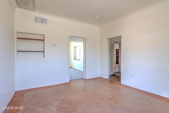 1125 W Huron St, Tucson, AZ 85745 - unfurnished room featuring tile patterned flooring