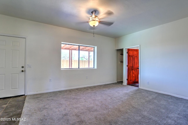 1125 W Huron St, Tucson, AZ 85745 - empty room with ceiling fan and dark colored carpet