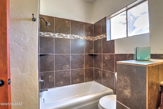 1125 W Huron St, Tucson, AZ 85745 - bathroom featuring a textured wall and tub / shower combination