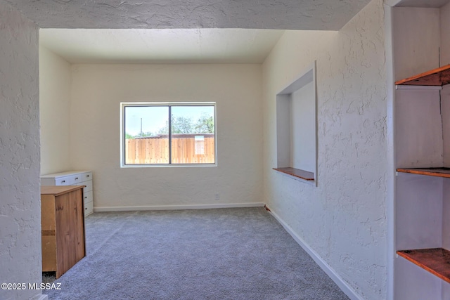 1125 W Huron St, Tucson, AZ 85745 - carpeted spare room with a textured wall