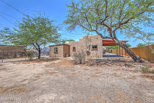 1125 W Huron St, Tucson, AZ 85745 - rear view of property with stucco siding