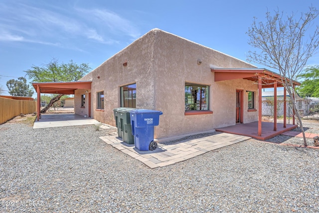 1125 W Huron St, Tucson, AZ 85745 - back of property featuring a patio area, a fenced backyard, and stucco siding